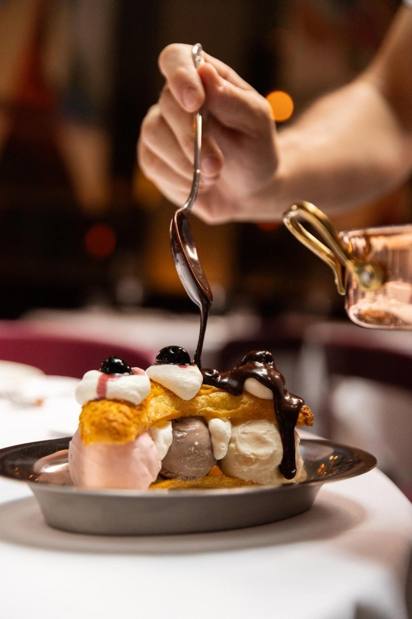 Hotel The Evelyn Nomad New York Esterno foto Chocolate syrup being drizzled over a dessert